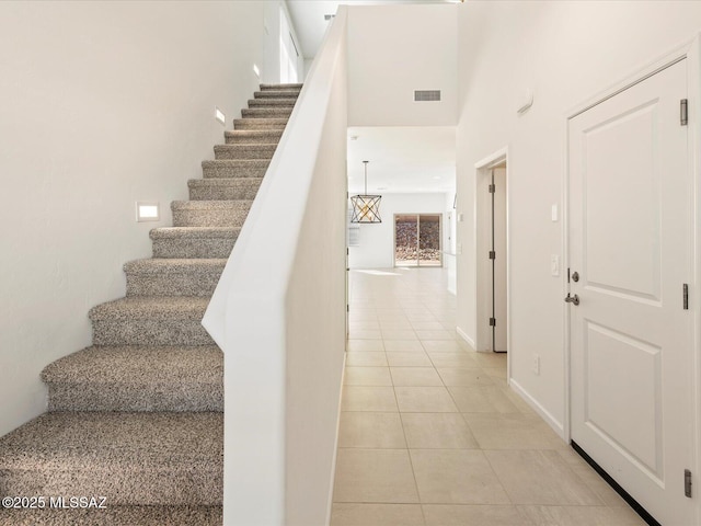 7005 W Jadewood Ln W, Tucson, AZ 85757 - stairs featuring tile patterned floors and visible vents
