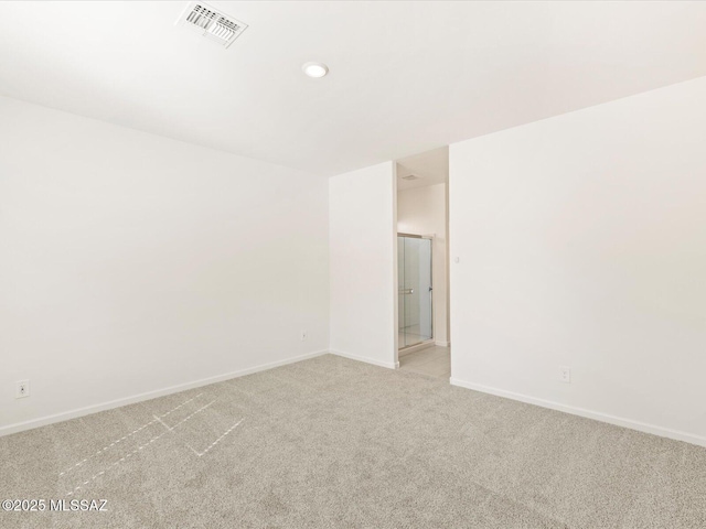 7005 W Jadewood Ln W, Tucson, AZ 85757 - carpeted spare room with baseboards and visible vents