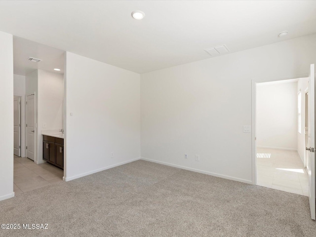 7005 W Jadewood Ln W, Tucson, AZ 85757 - empty room with recessed lighting, light tile patterned floors, light colored carpet, and visible vents