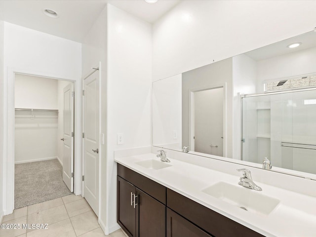 7005 W Jadewood Ln W, Tucson, AZ 85757 - bathroom with tile patterned floors, a stall shower, double vanity, and a sink