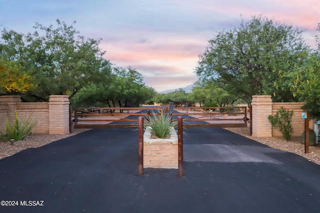 view of gate at dusk