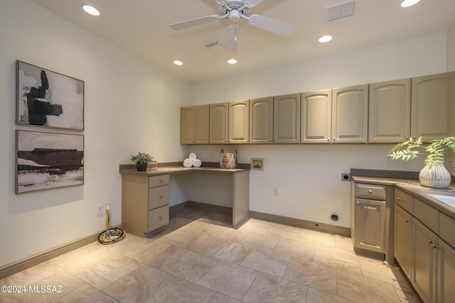 office space featuring ceiling fan and built in desk