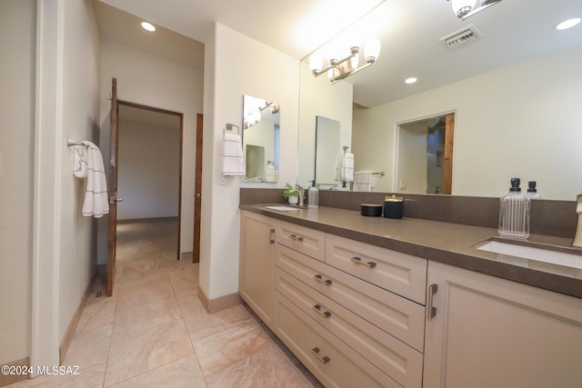 bathroom featuring tile patterned floors and vanity