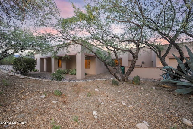 view of property exterior at dusk