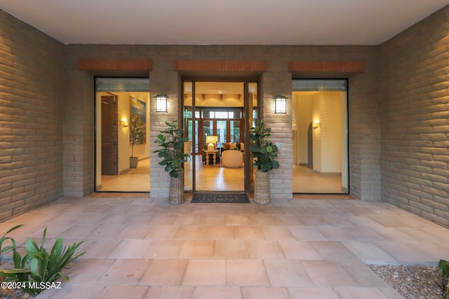 property entrance with a patio