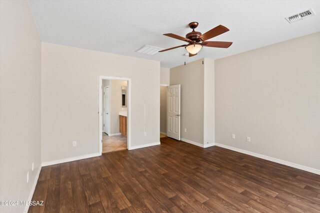 unfurnished bedroom with dark tile patterned flooring and ceiling fan