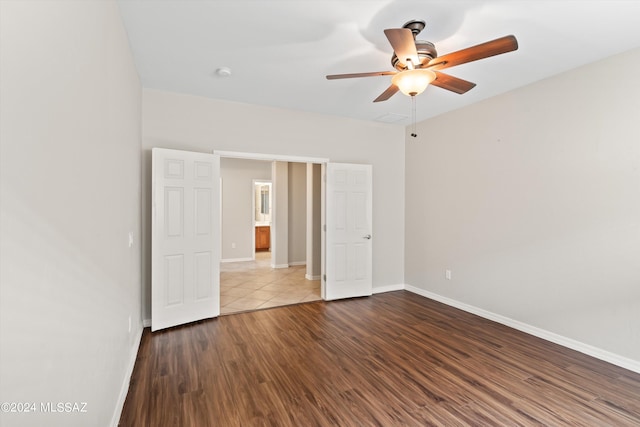 unfurnished bedroom featuring ceiling fan and hardwood / wood-style flooring