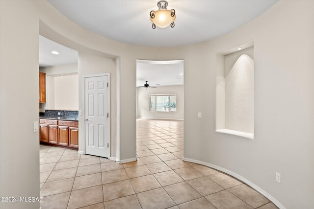 hall with light tile patterned flooring