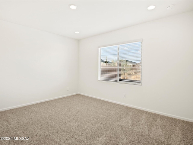 unfurnished room with recessed lighting, baseboards, and carpet floors