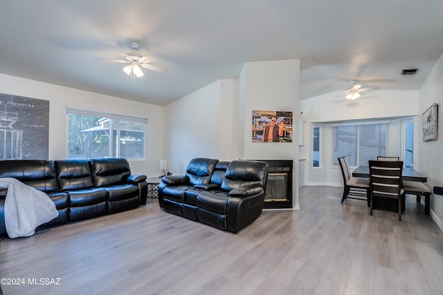 living room featuring ceiling fan and light hardwood / wood-style floors