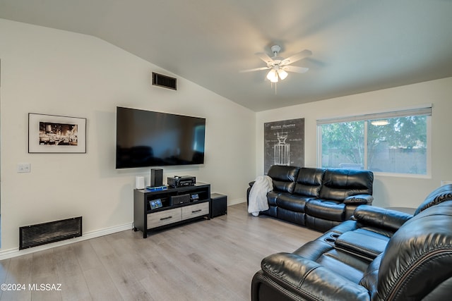 living room with light hardwood / wood-style floors, lofted ceiling, and ceiling fan