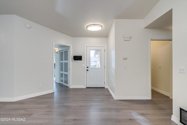 foyer entrance with light hardwood / wood-style flooring