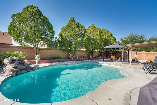 view of swimming pool with a gazebo and a patio