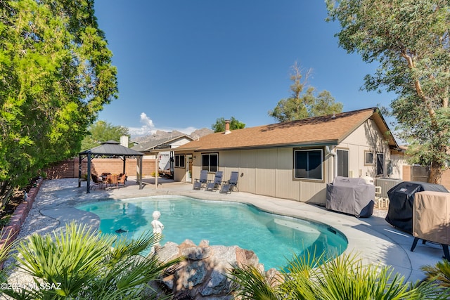 view of pool with a gazebo, a patio area, and grilling area