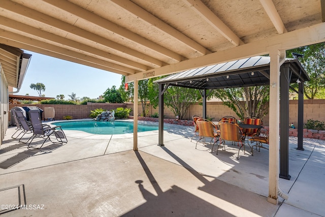 view of pool with a gazebo and a patio area