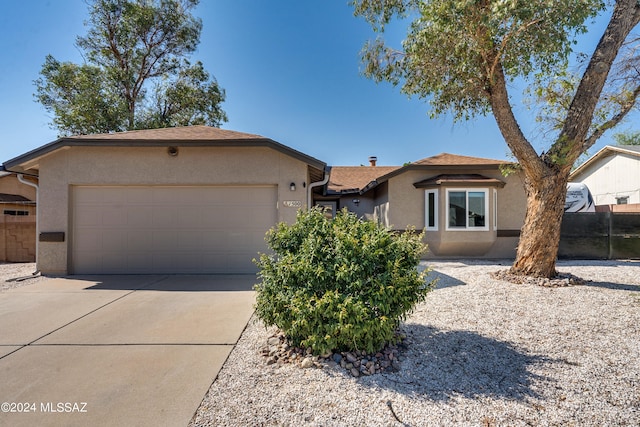 ranch-style house featuring a garage