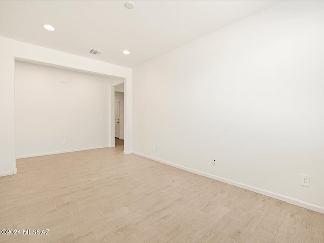 unfurnished room with light hardwood / wood-style floors