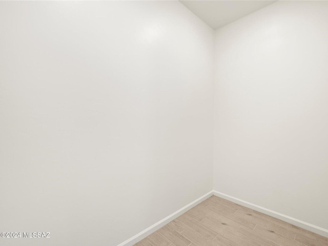 unfurnished room featuring light hardwood / wood-style flooring