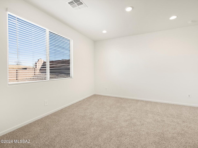 unfurnished room featuring carpet flooring