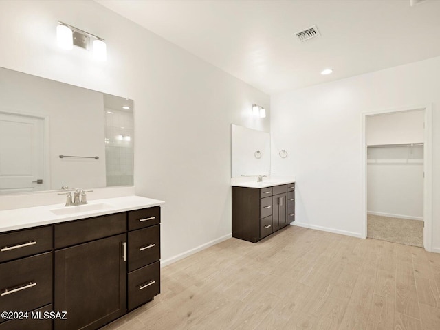 bathroom featuring vanity and hardwood / wood-style floors