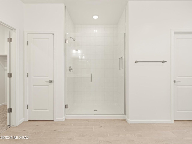 bathroom with an enclosed shower