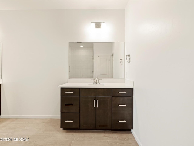 bathroom with vanity and walk in shower