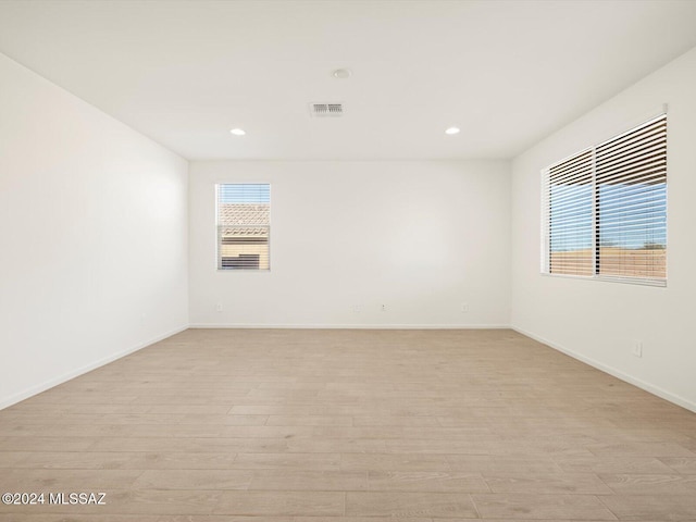 spare room featuring light wood-type flooring