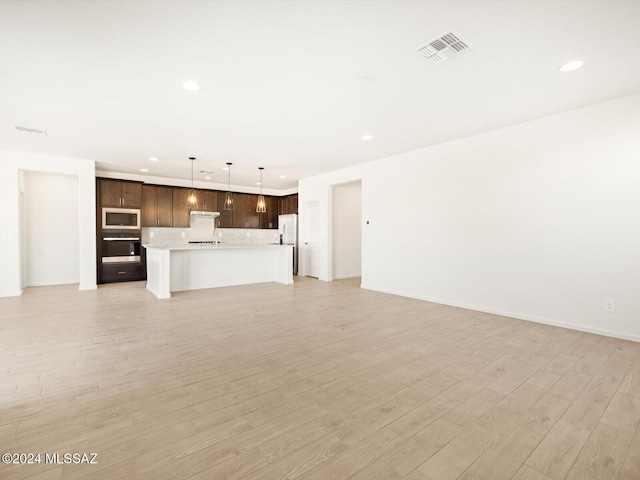 unfurnished living room featuring light wood-type flooring