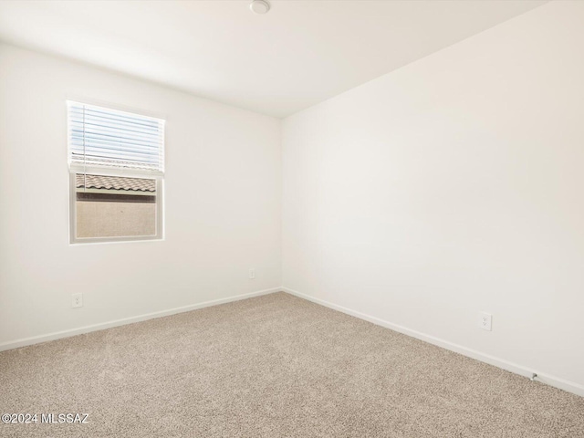 spare room featuring carpet flooring