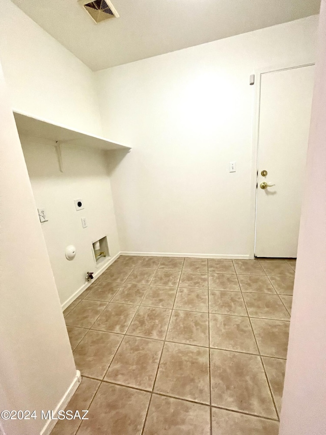 laundry area with washer hookup, tile patterned flooring, hookup for an electric dryer, and hookup for a gas dryer