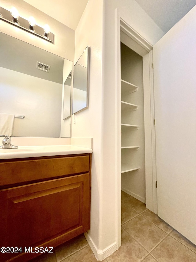 bathroom with vanity and tile patterned floors