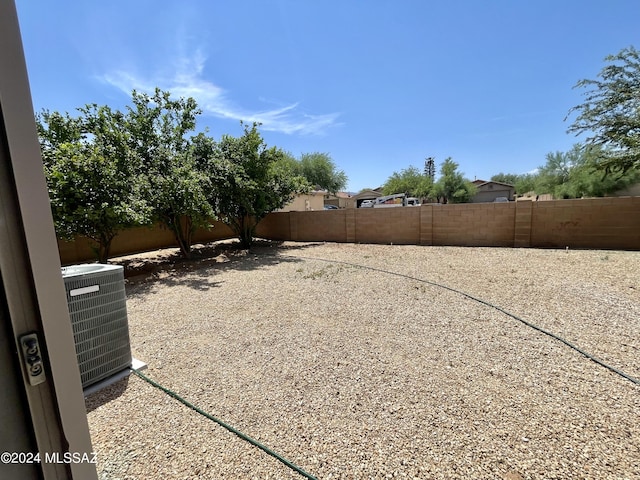 view of yard with central air condition unit