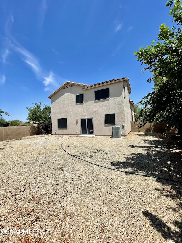 back of house featuring central AC