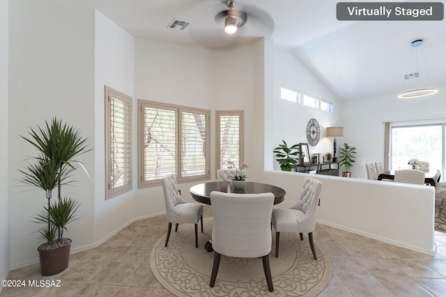 dining room featuring high vaulted ceiling and ceiling fan