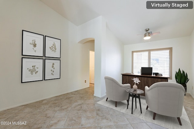 interior space featuring ceiling fan and lofted ceiling