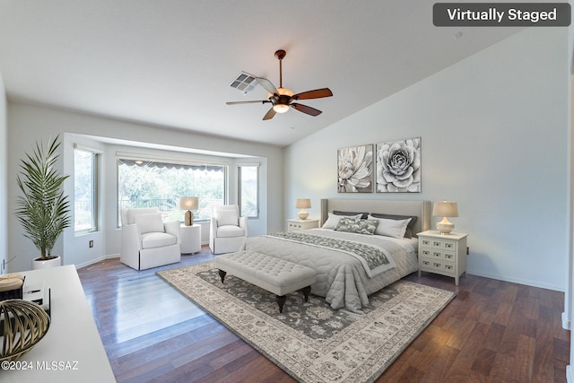 bedroom featuring ceiling fan, dark hardwood / wood-style flooring, and lofted ceiling