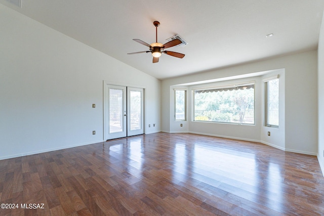 spare room featuring ceiling fan, dark hardwood / wood-style flooring, lofted ceiling, and french doors