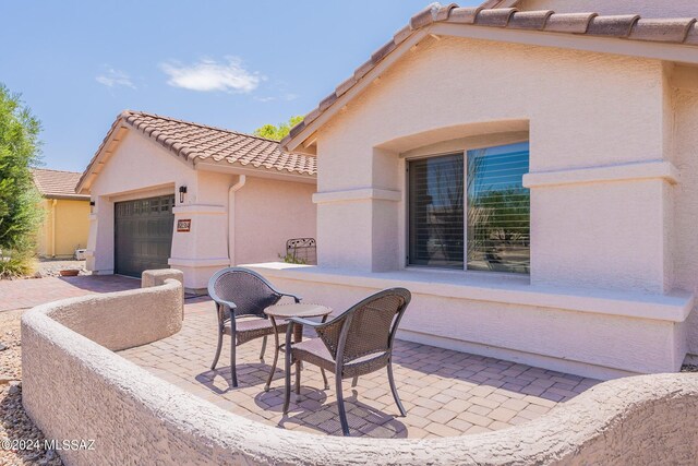 view of patio with a garage