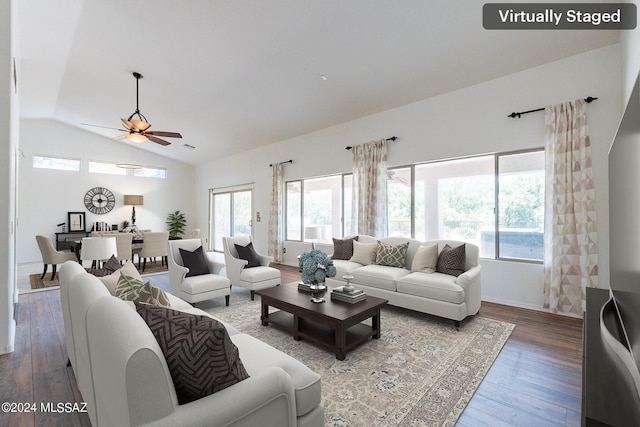 living room with ceiling fan, lofted ceiling, and hardwood / wood-style flooring