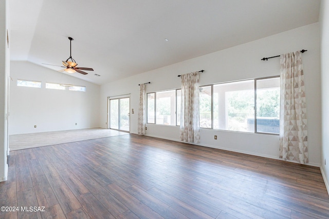 spare room with ceiling fan, plenty of natural light, dark hardwood / wood-style flooring, and lofted ceiling