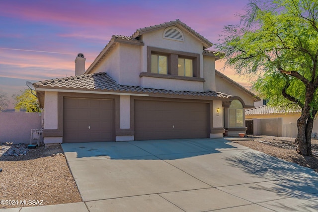 view of front of property featuring a garage