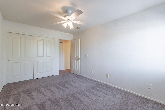 unfurnished bedroom featuring carpet flooring, ceiling fan, and a closet