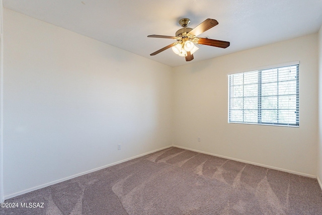 carpeted empty room with ceiling fan