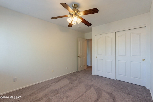 unfurnished bedroom featuring a closet, ceiling fan, and carpet