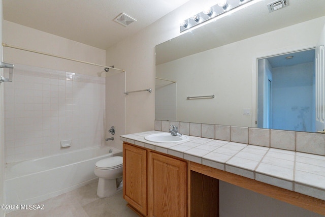 full bathroom featuring shower / washtub combination, vanity, tile patterned floors, and toilet