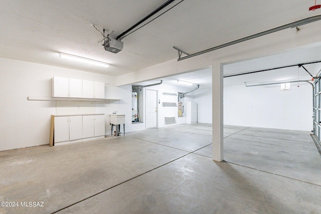 garage with sink and a garage door opener