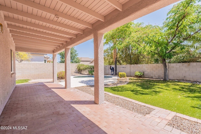 view of patio / terrace with a fenced in pool