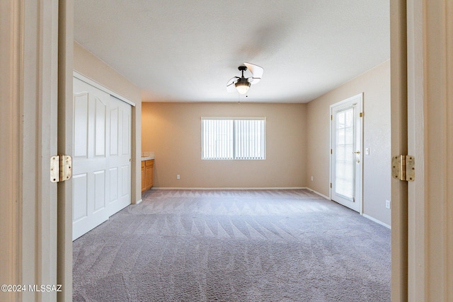 unfurnished room featuring carpet flooring