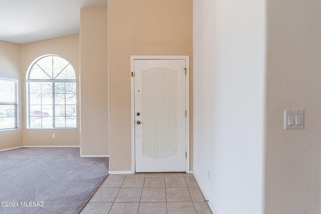 view of carpeted entrance foyer