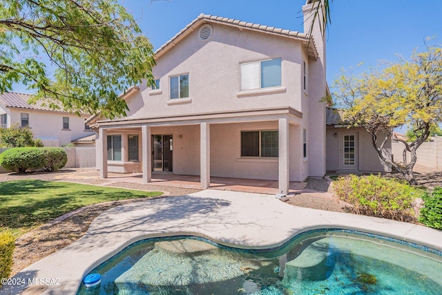 rear view of house with a patio